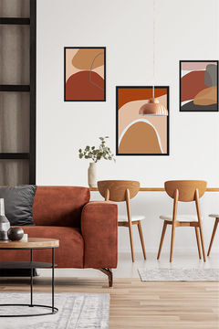 living room interior with 3 abstract paintings on the wall
