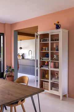 Peach wall and white cabinet