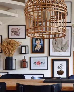 artistic white wall in dining room with an art wall collage